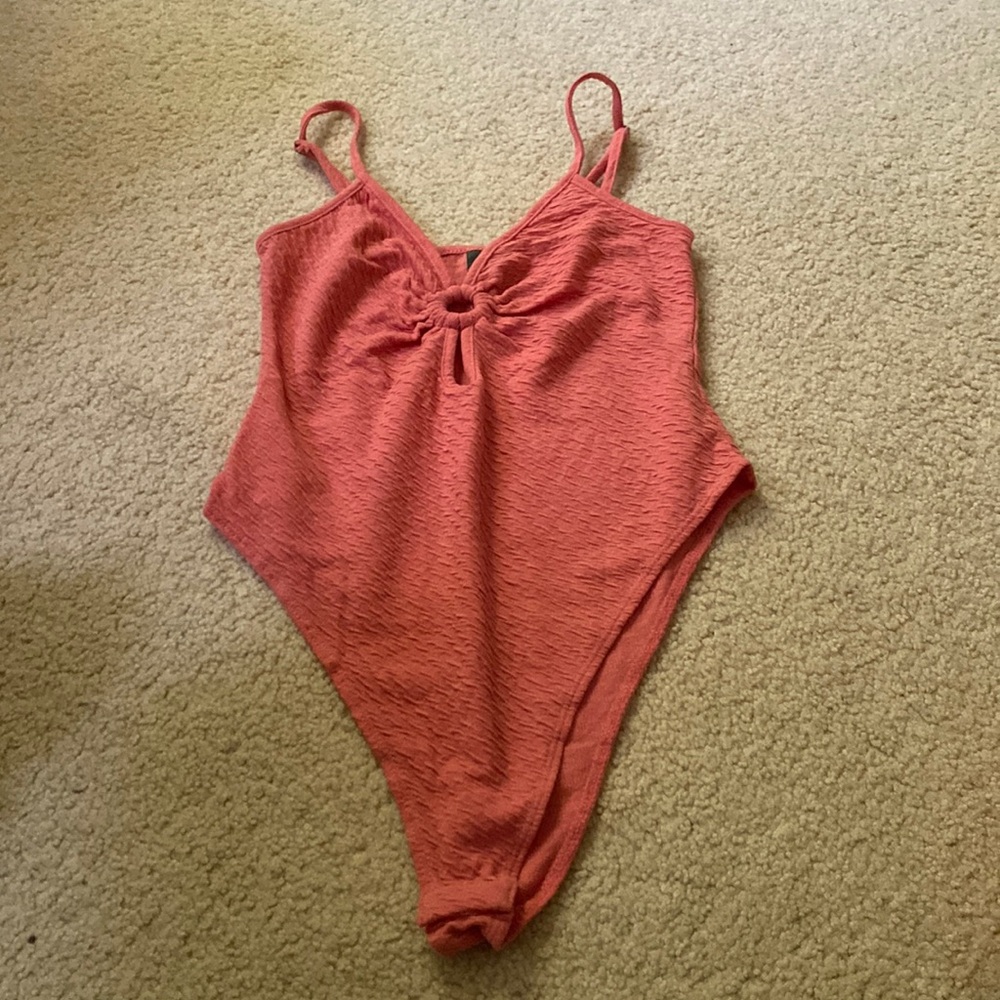 Body suit with adjustable straps